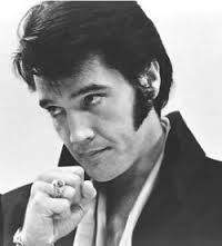 1969 Elvis press conference tense look closed fist