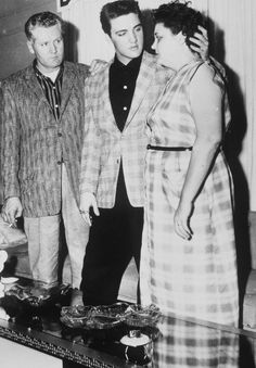 BIO Army induction Elvis with Gladys and Vernon full length his hand lovingly Gladys back head